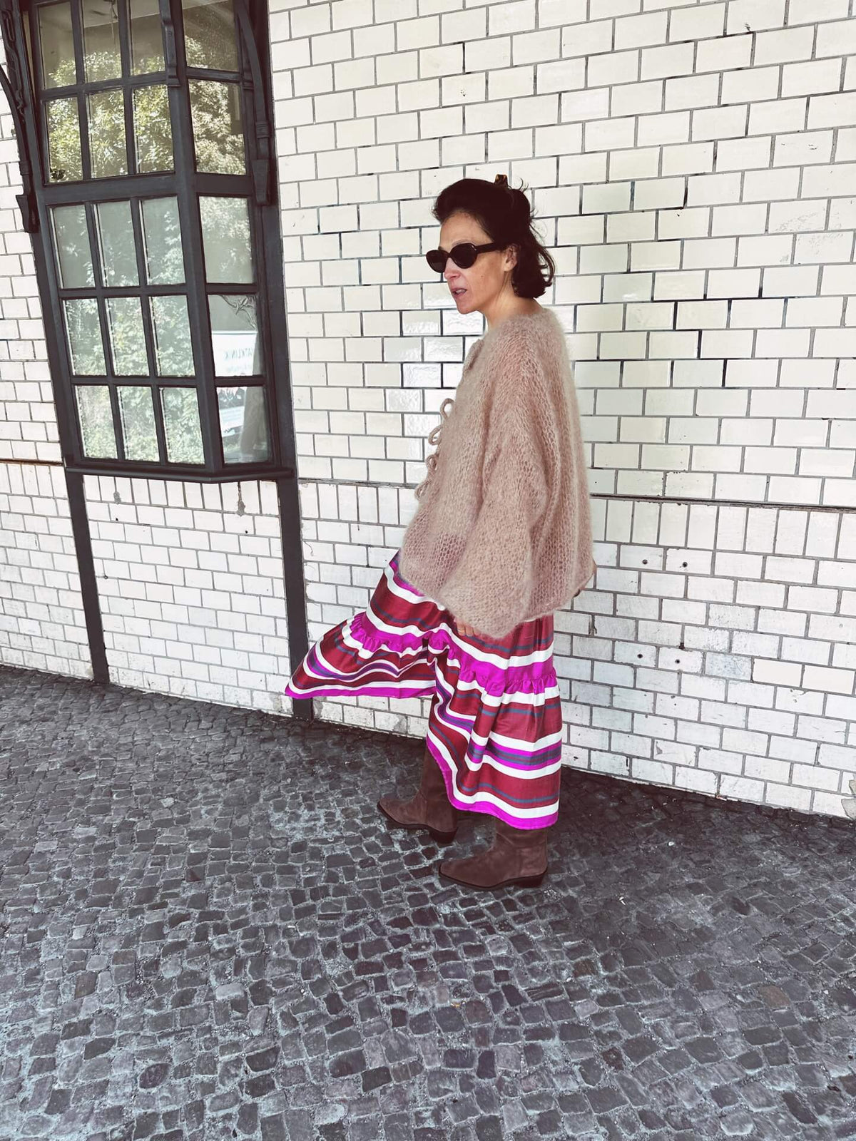 Jenna skirt worn side — model wearing Aleksandra Viktor luxury silk ikat skirt with natural dyed fabric