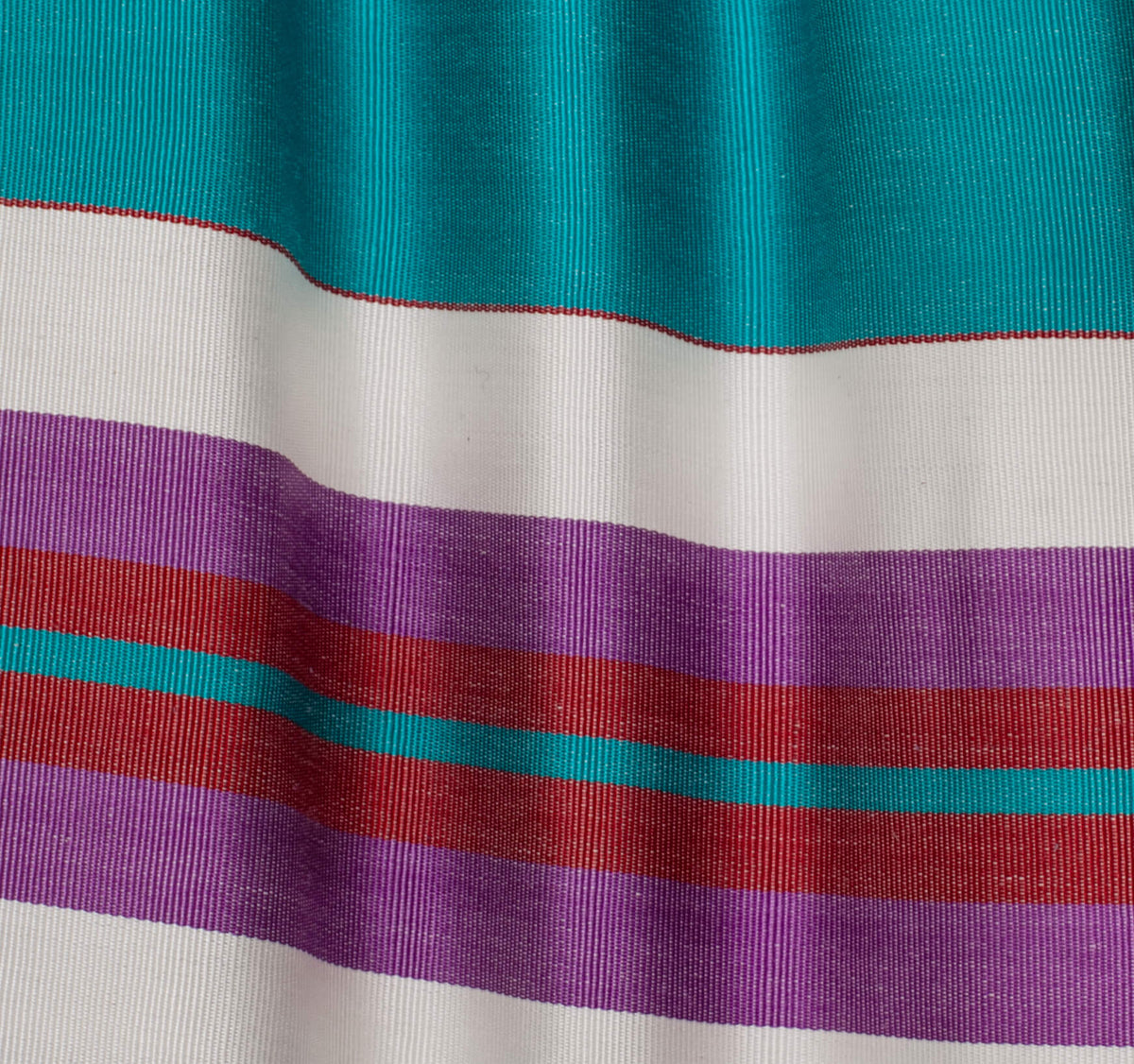 Berenika skirt fabric close-up — handwoven silk ikat weaving detail by Aleksandra Viktor master artisans in Uzbekistan