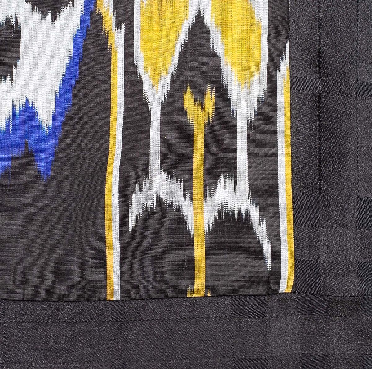 Zuza short coat close-up — double ikat weaving detail by Aleksandra Viktor master artisans in Uzbekistan