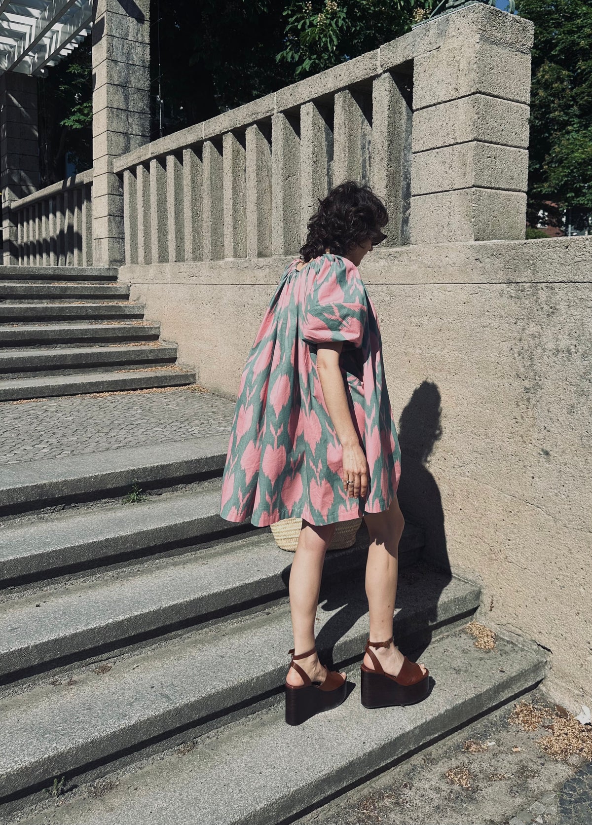 Cora luxury ikat cotton short dress worn outdoors — Aleksandra Viktor handwoven cotton dress in traditional Central Asian ikat design