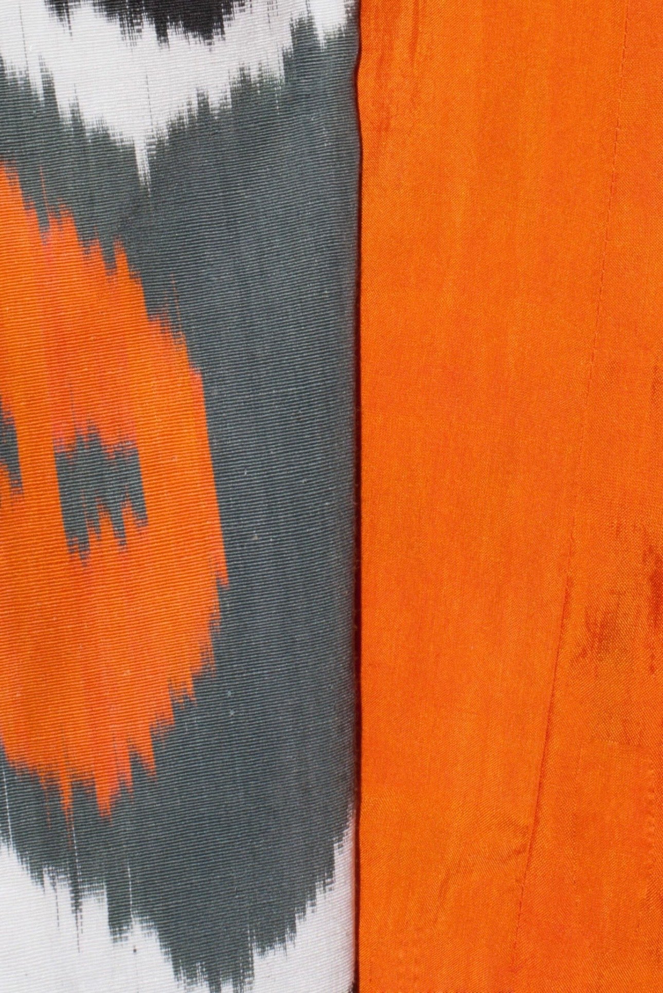 Sandra Short Coat fabric detail — handwoven ikat cotton pattern close-up by Aleksandra Viktor