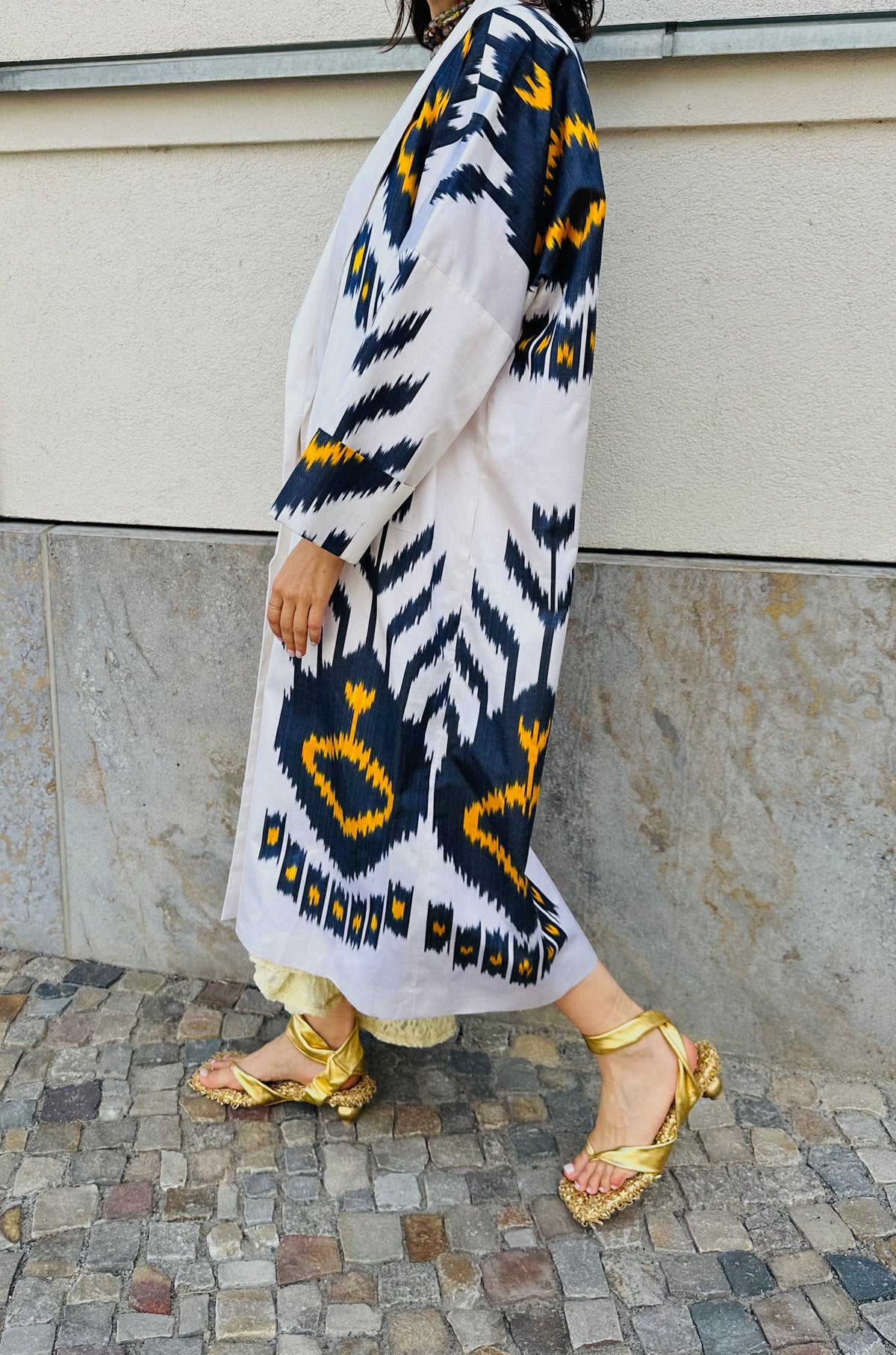 Tatjana silk coat worn side — model wearing Aleksandra Viktor handwoven ikat silk coat, sustainably crafted in Uzbekistan