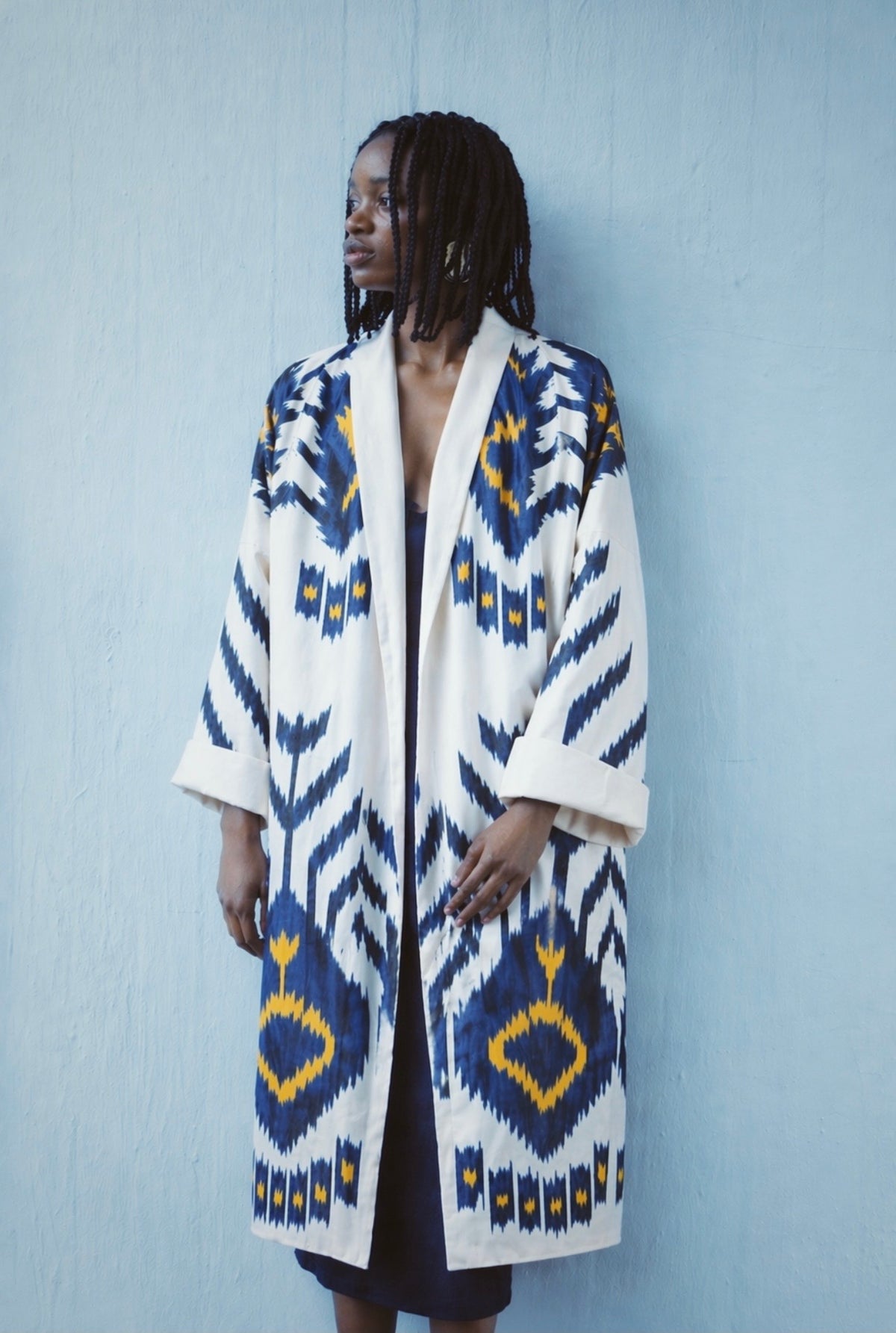 Tatjana luxury ikat silk coat worn side — model wearing Aleksandra Viktor bespoke handwoven silk coat, sustainably crafted in Uzbekistan