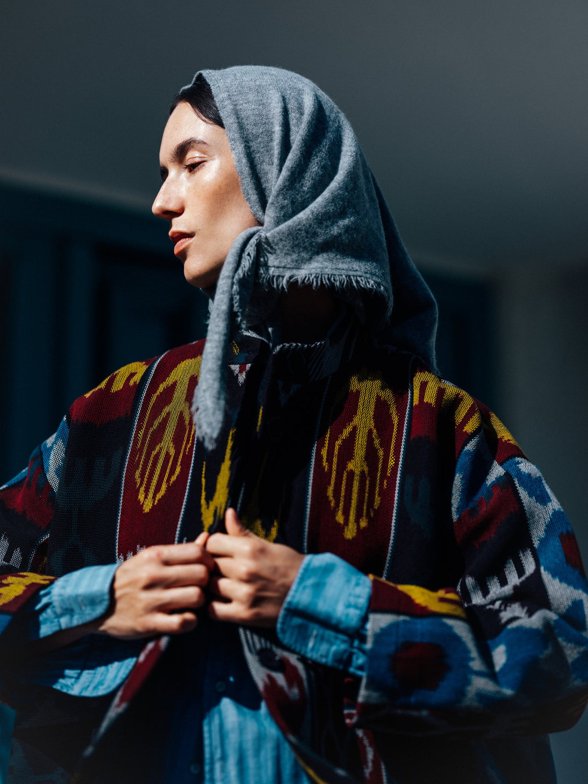 Jana ikat jacket close-up — handwoven ikat motifs in mustard yellow on burgundy
