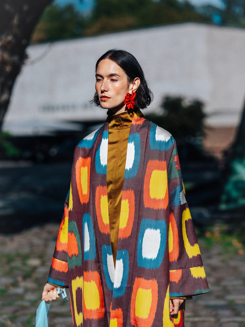 Roberta ikat coat worn open — painterly multicolour ikat with wide sleeves