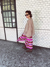 Jenna skirt worn side — model wearing Aleksandra Viktor luxury silk ikat skirt with natural dyed fabric