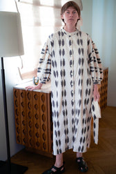 Tarima luxury ikat cotton dress worn front — model wearing Aleksandra Viktor handwoven cotton dress in vibrant ikat pattern