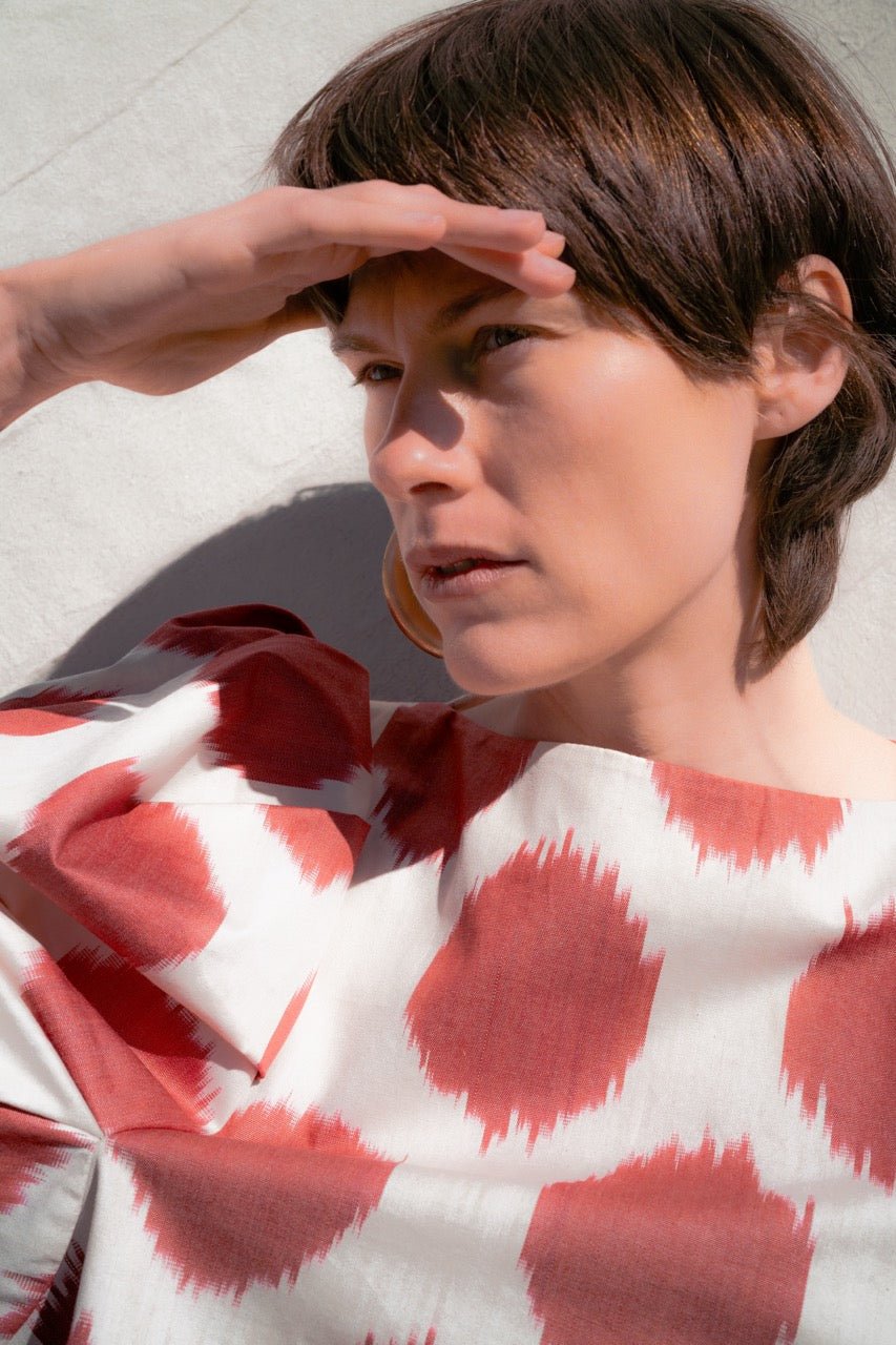 Mafalda luxury ikat cotton blouse worn outdoors — Aleksandra Viktor handwoven cotton blouse in traditional Central Asian ikat design