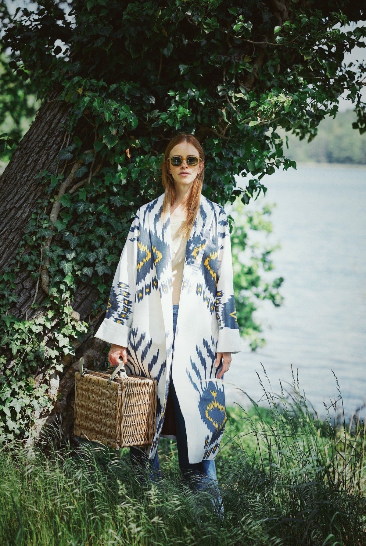 Tatjana luxury ikat silk coat worn outdoors — Aleksandra Viktor handwoven silk coat in traditional Central Asian ikat design