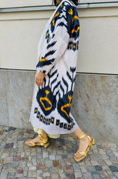 Tatjana silk coat worn side — model wearing Aleksandra Viktor handwoven ikat silk coat, sustainably crafted in Uzbekistan