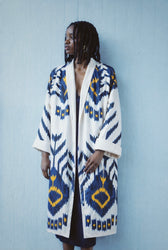 Tatjana luxury ikat silk coat worn side — model wearing Aleksandra Viktor bespoke handwoven silk coat, sustainably crafted in Uzbekistan