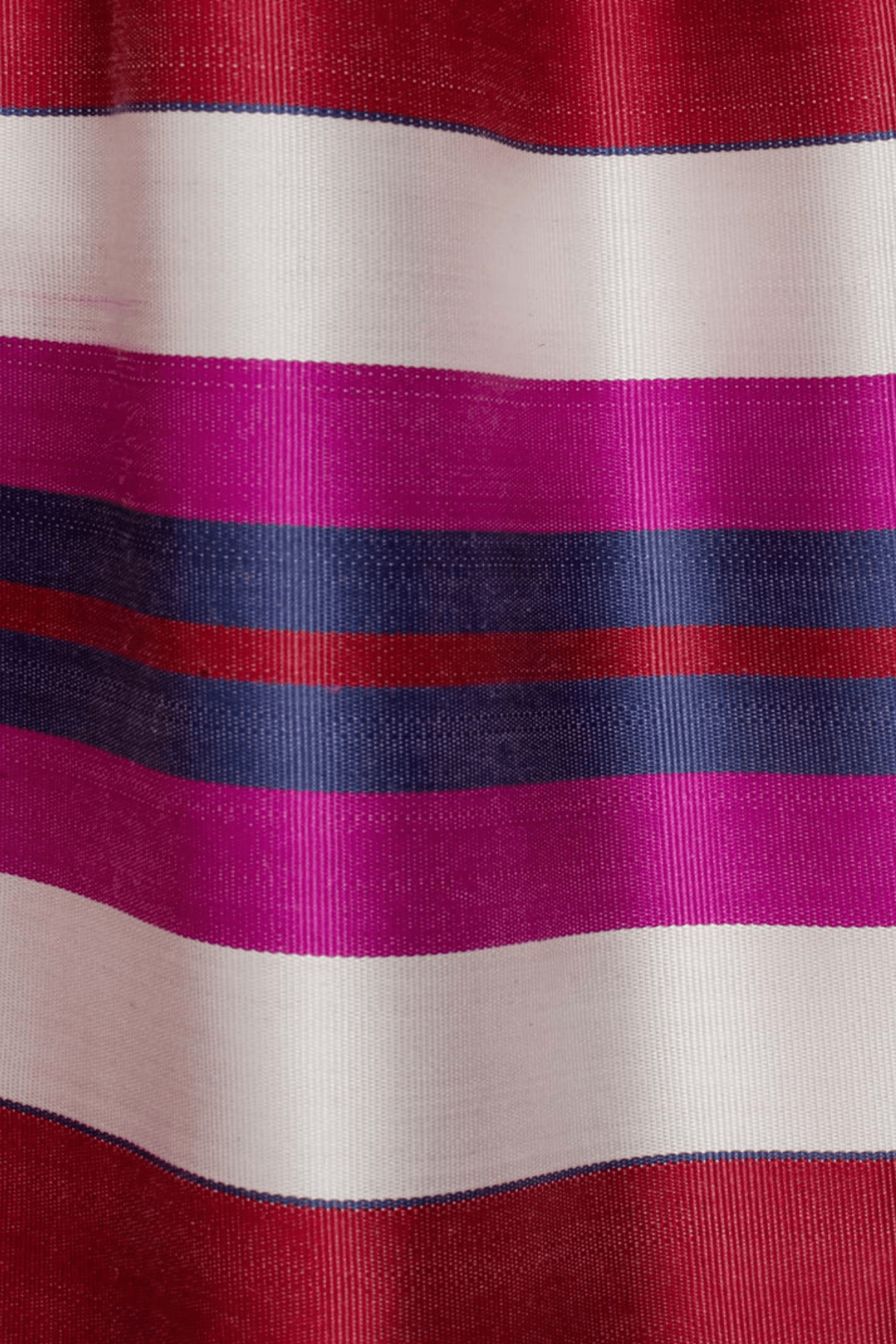 Jenna skirt fabric close-up — handwoven silk ikat weaving detail by Aleksandra Viktor master artisans in Uzbekistan