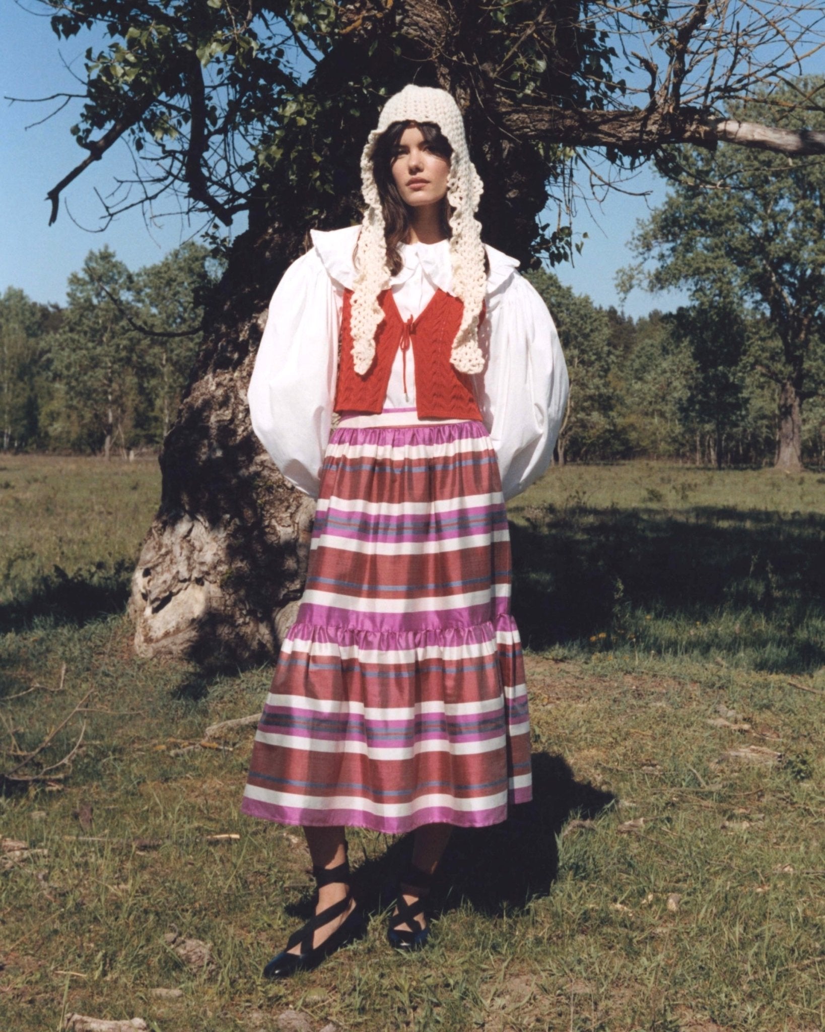 Jenna skirt worn front with weird headscarf — model wearing Aleksandra Viktor exclusively tailored luxury silk ikat skirt