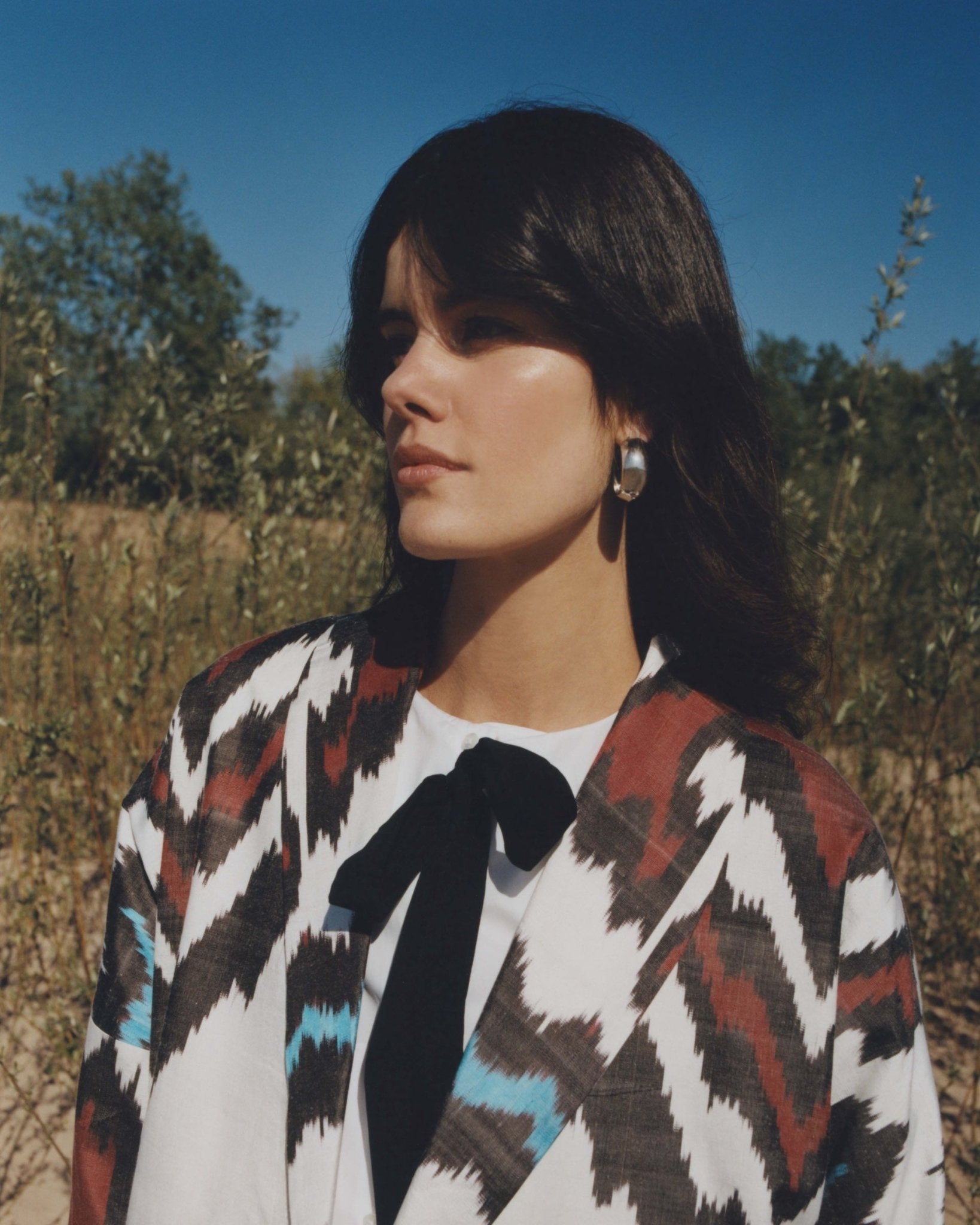 Nela silk coat close-up — double ikat weaving detail by Aleksandra Viktor master artisans in Uzbekistan