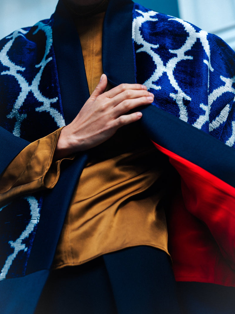 Eva ikat velvet jacket detail — handwoven blue velvet ikat with navy collar and red lining