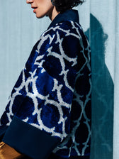 Eva ikat velvet jacket side view — wide kimono sleeves with navy cuffs, Aleksandra Viktor Berlin