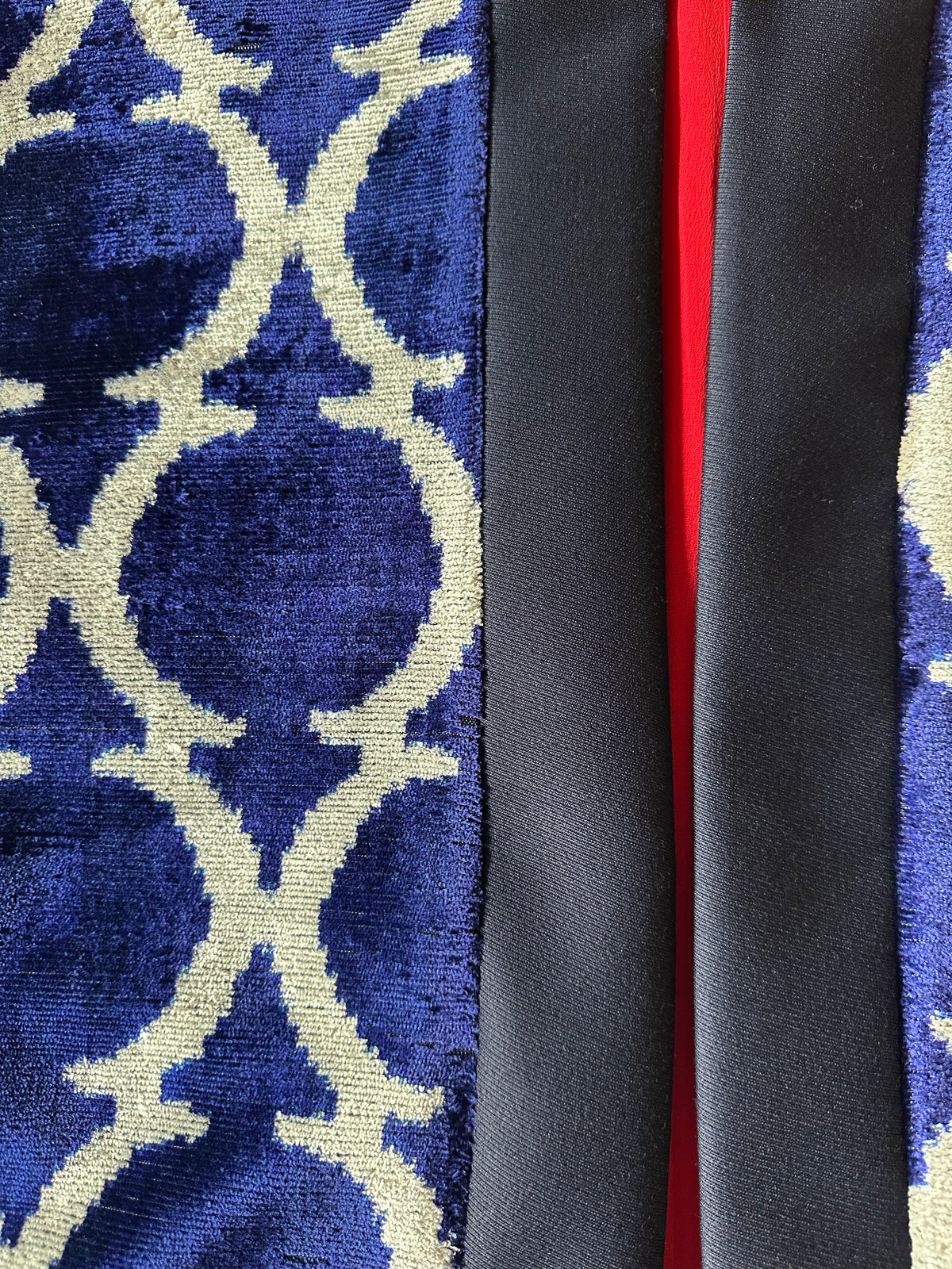 Eva ikat velvet silk jacket detail — navy front band and red silk lining beside blue velvet ikat