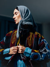 Jana ikat jacket close-up — handwoven ikat motifs in mustard yellow on burgundy