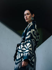 Laura ikat coat — large black and ecru ikat motifs on wide kimono sleeves