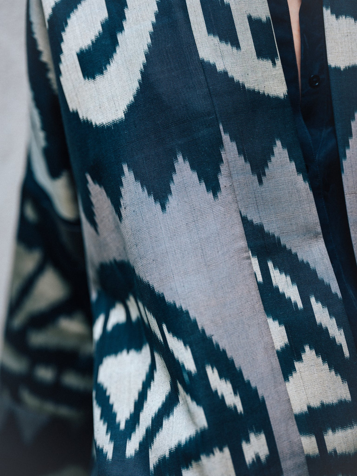 Laura ikat coat fabric close-up — feathered edges of handwoven ikat