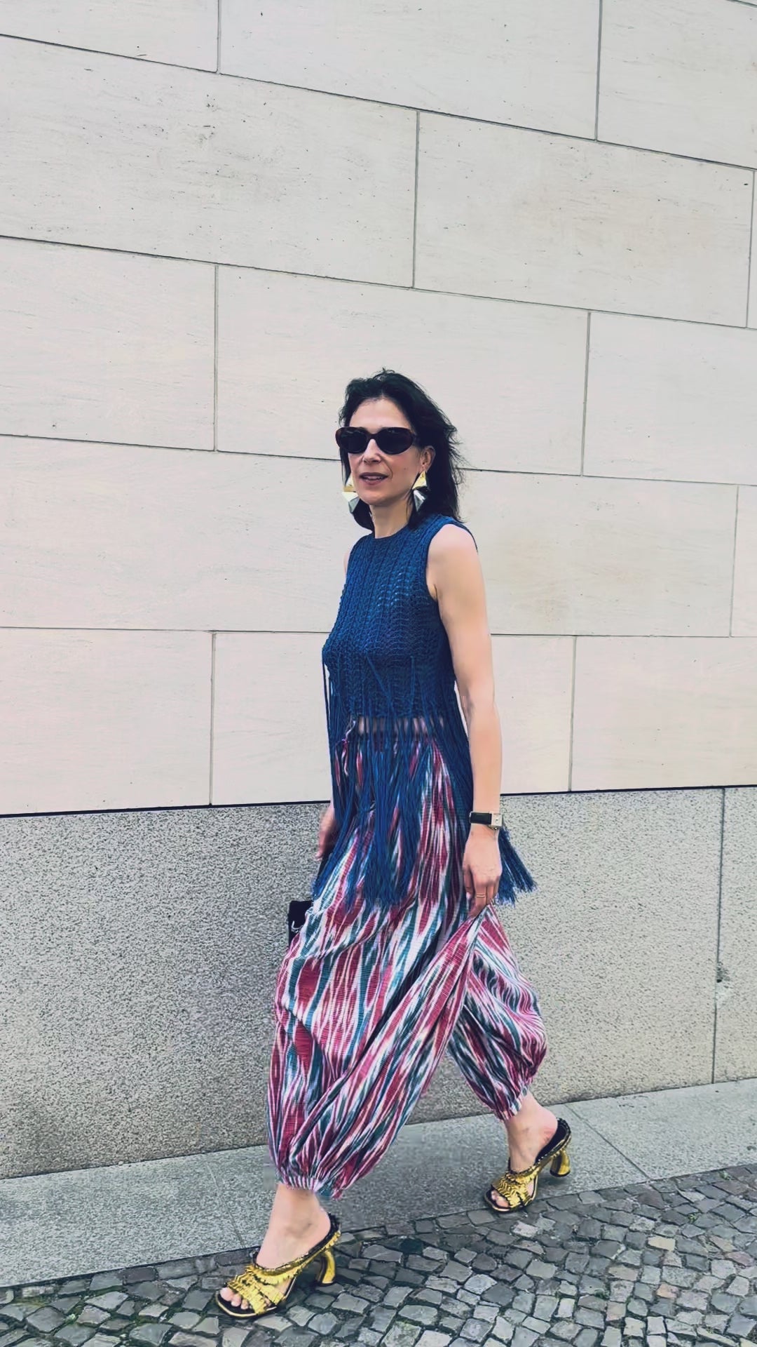 Arianna trousers by Aleksandra Viktor — luxury ikat silk trousers in motion, handcrafted using centuries-old weaving traditions