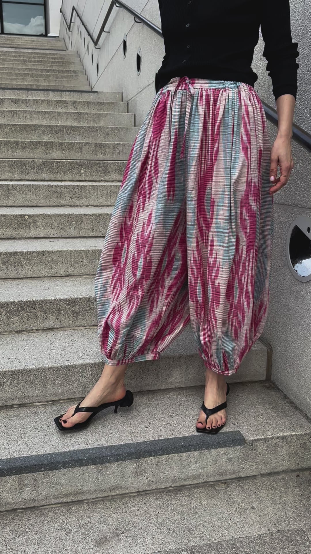 Marysia trousers by Aleksandra Viktor — luxury ikat silk trousers in motion, handcrafted using centuries-old weaving traditions