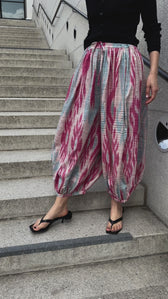 Marysia trousers by Aleksandra Viktor — luxury ikat silk trousers in motion, handcrafted using centuries-old weaving traditions