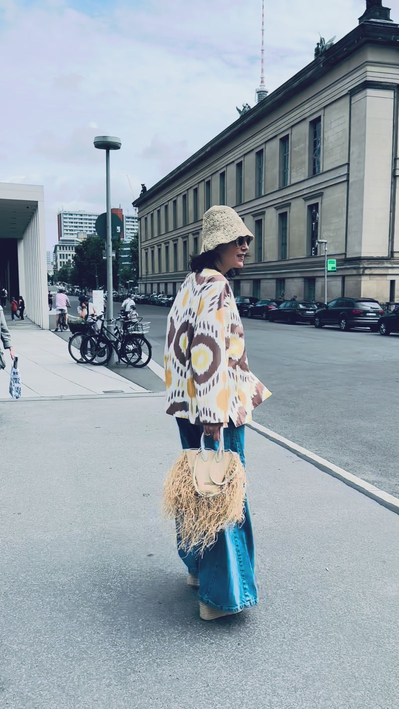 Lara overshirt by Aleksandra Viktor — luxury ikat silk overshirt in motion, handcrafted using centuries-old weaving traditions