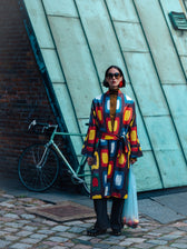 Roberta ikat coat by Aleksandra Viktor — colourful handwoven Uzbek ikat in yellow, red, blue and white on aubergine, belted kimono-style coat